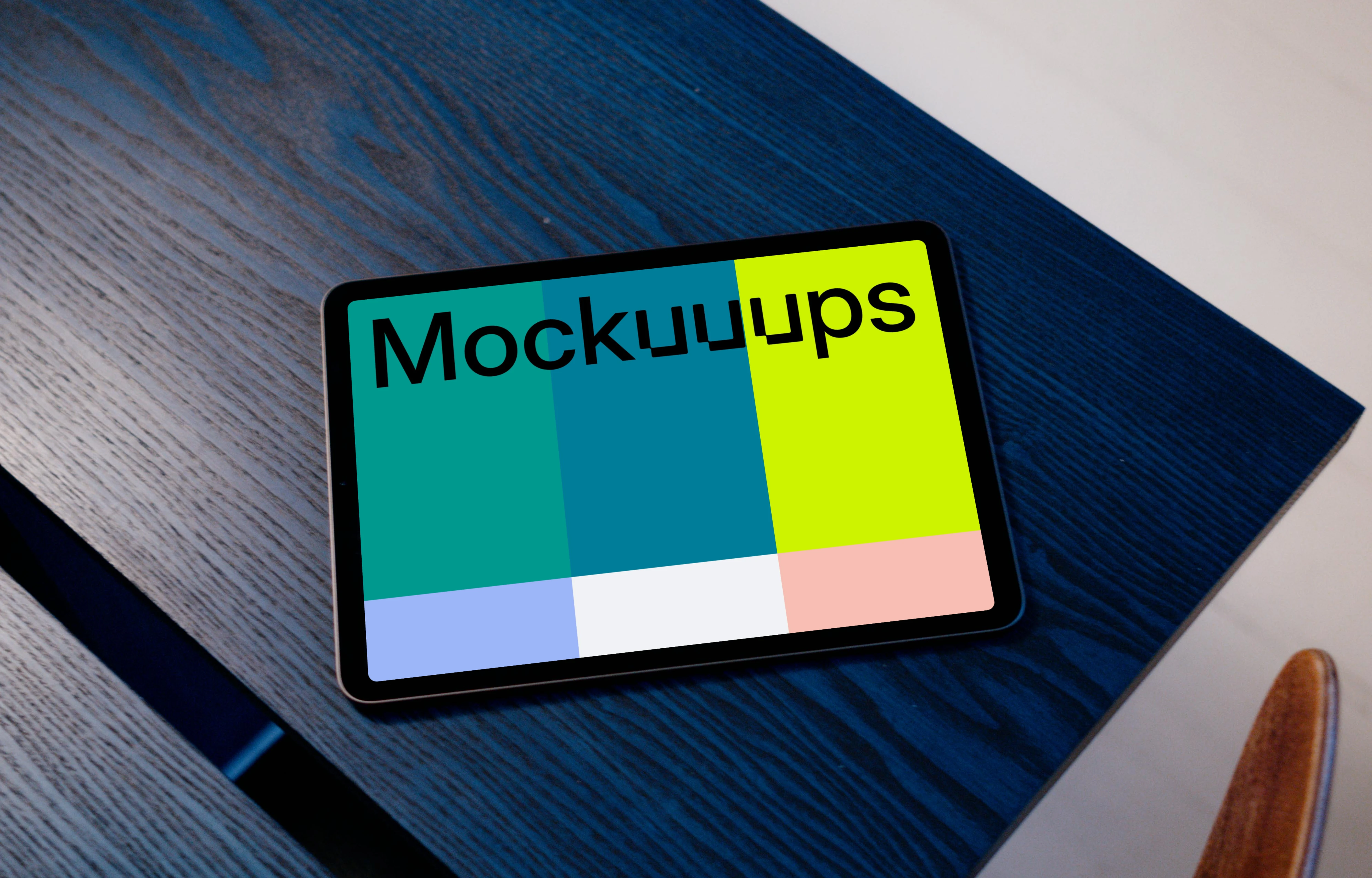 iPad Air mockup on a blue table with a white background