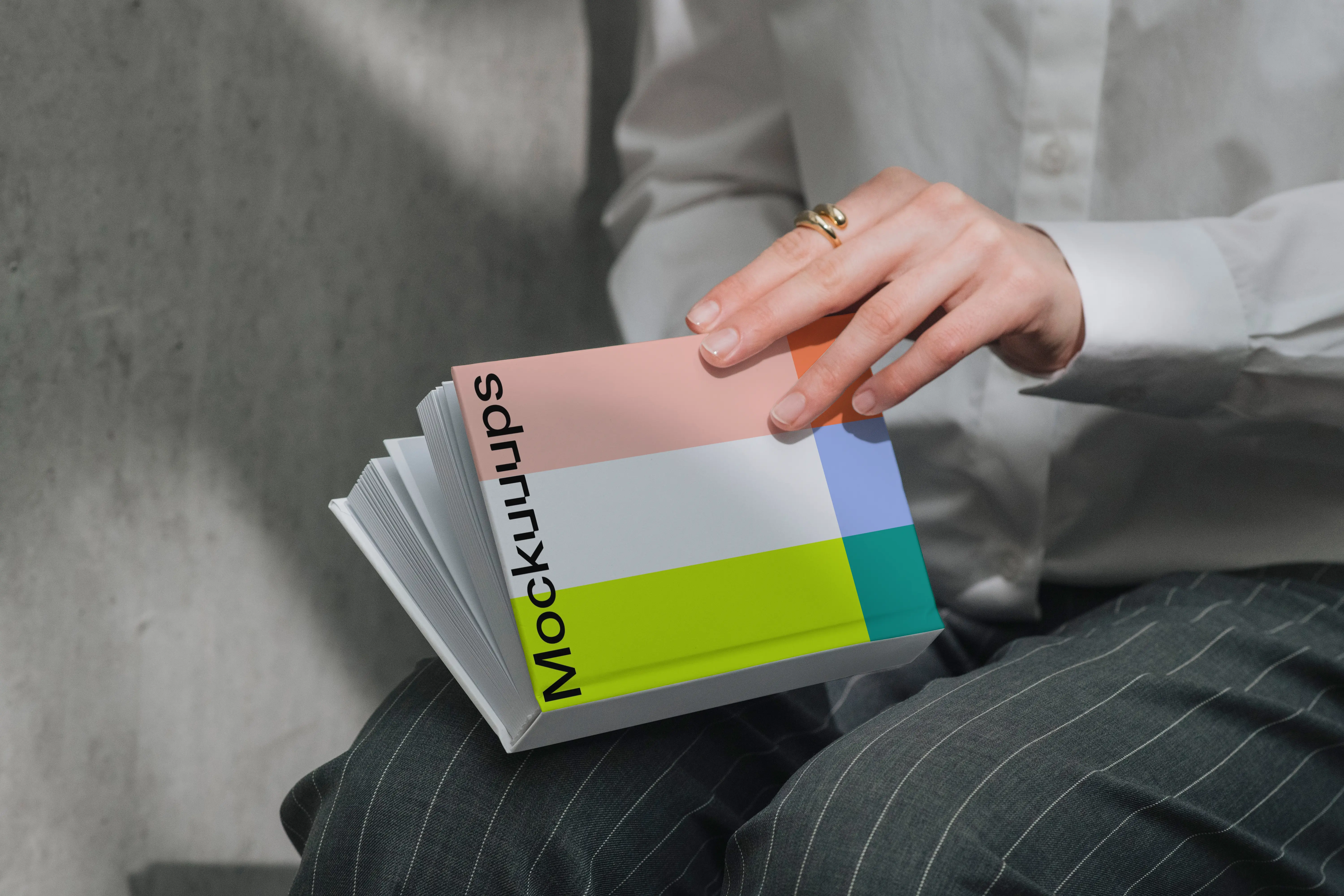 A-format book mockup held in hands mockup