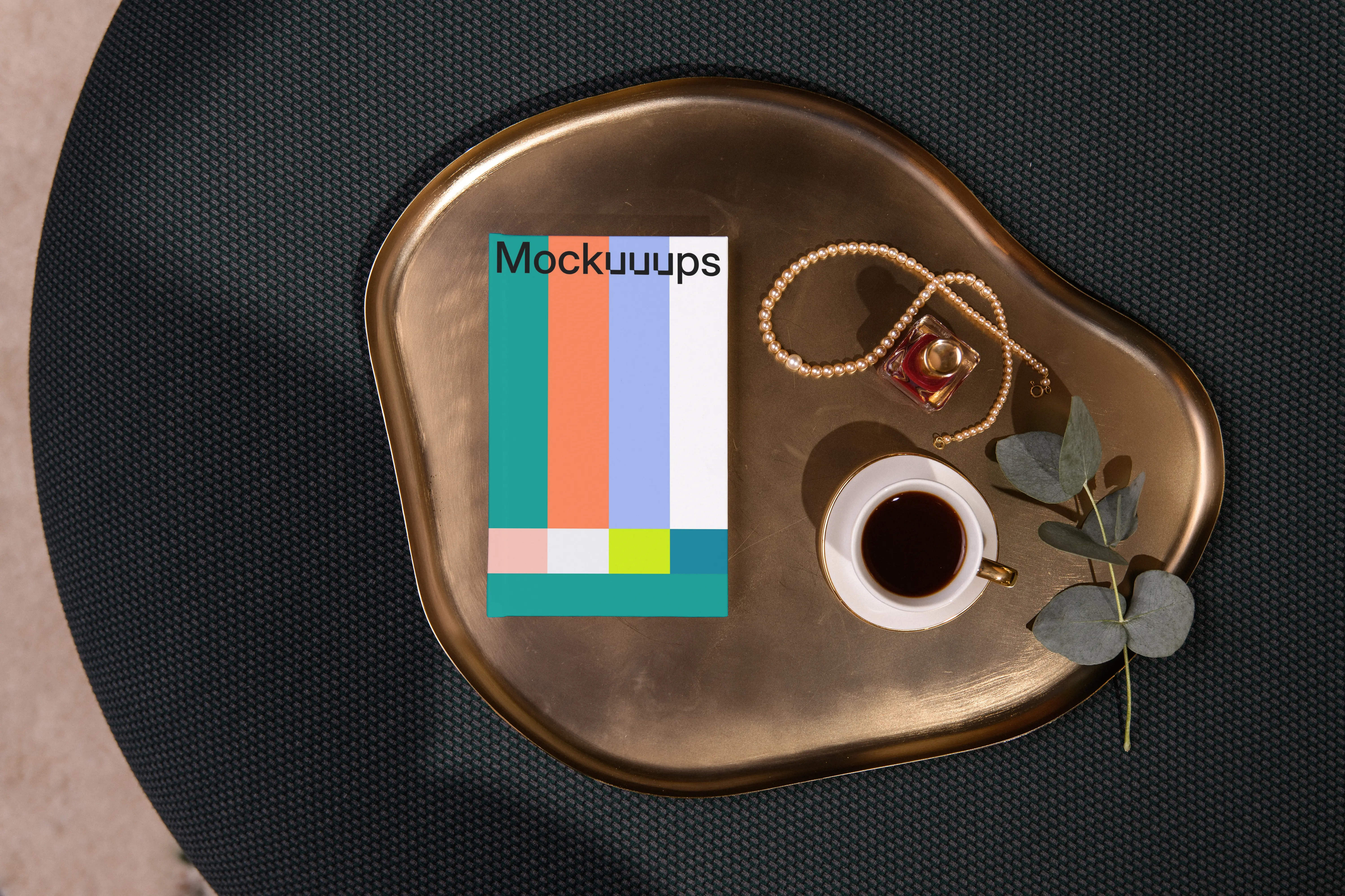 A-format book mockup on a golden tray with coffee and accessories mockup