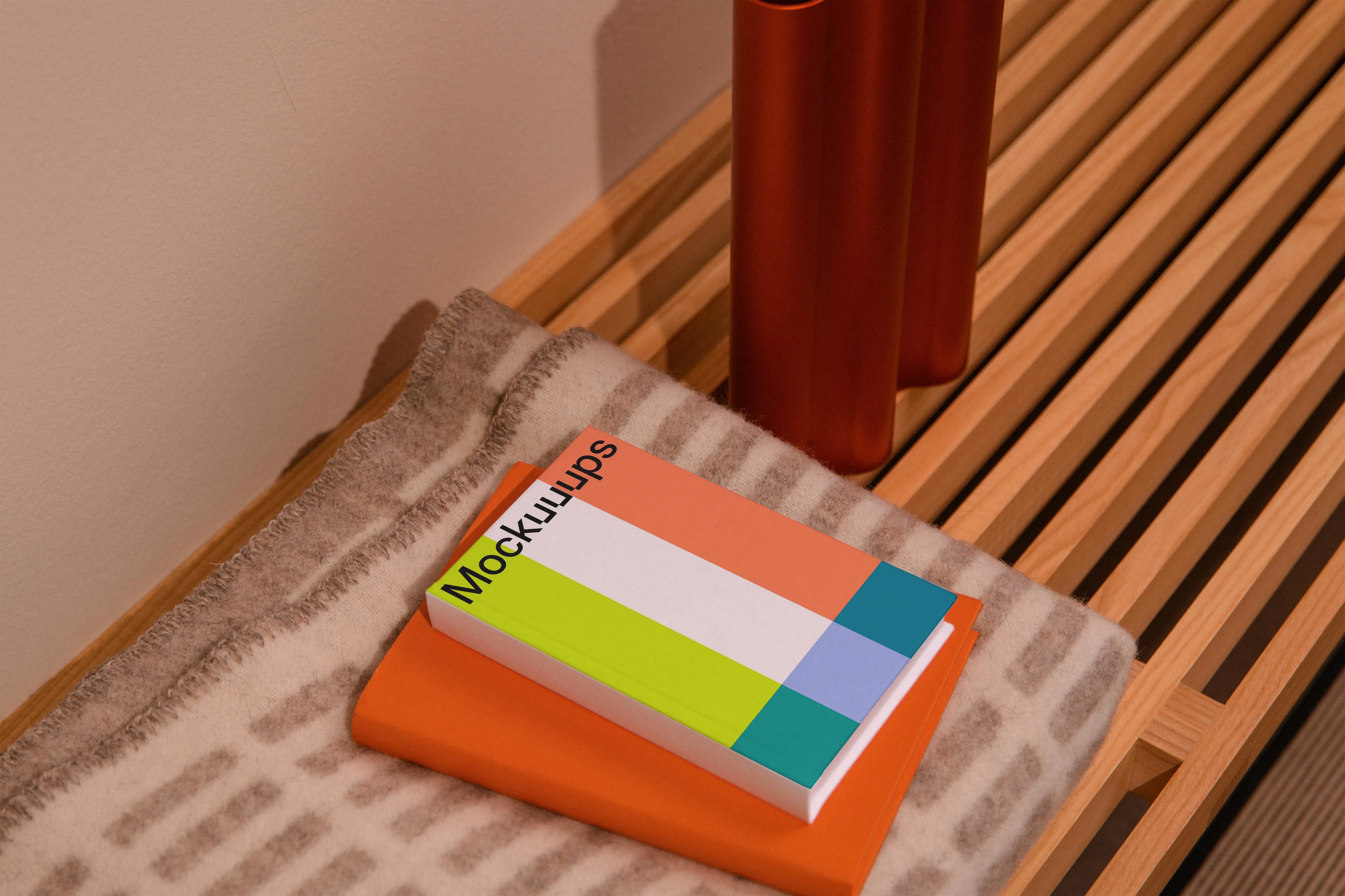 A-format book mockup on a wooden bench with decor mockup