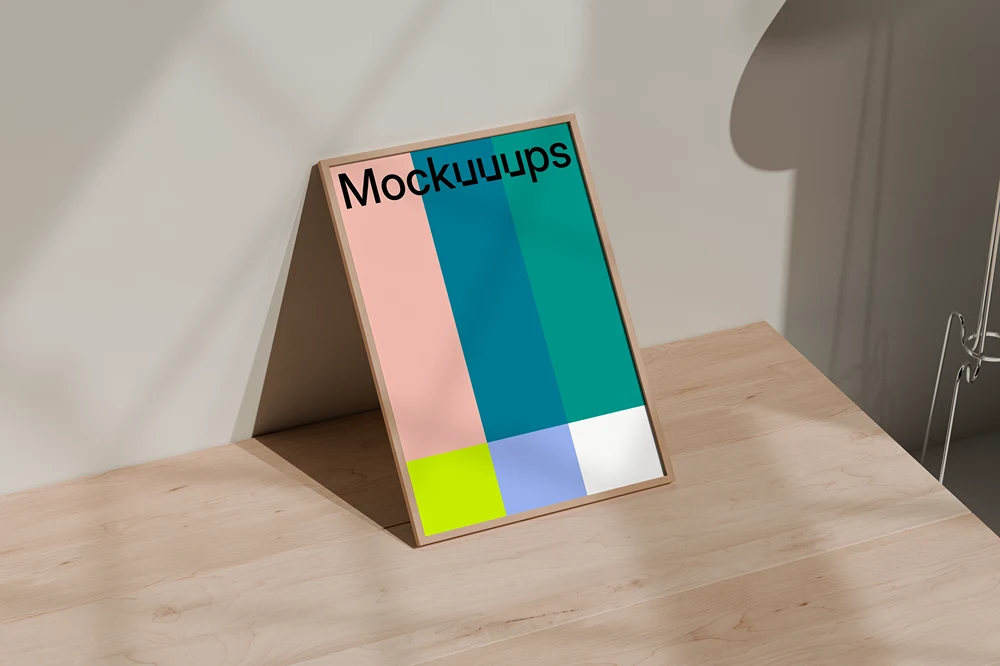 A3 poster mockup on a wooden table with muted lighting mockup