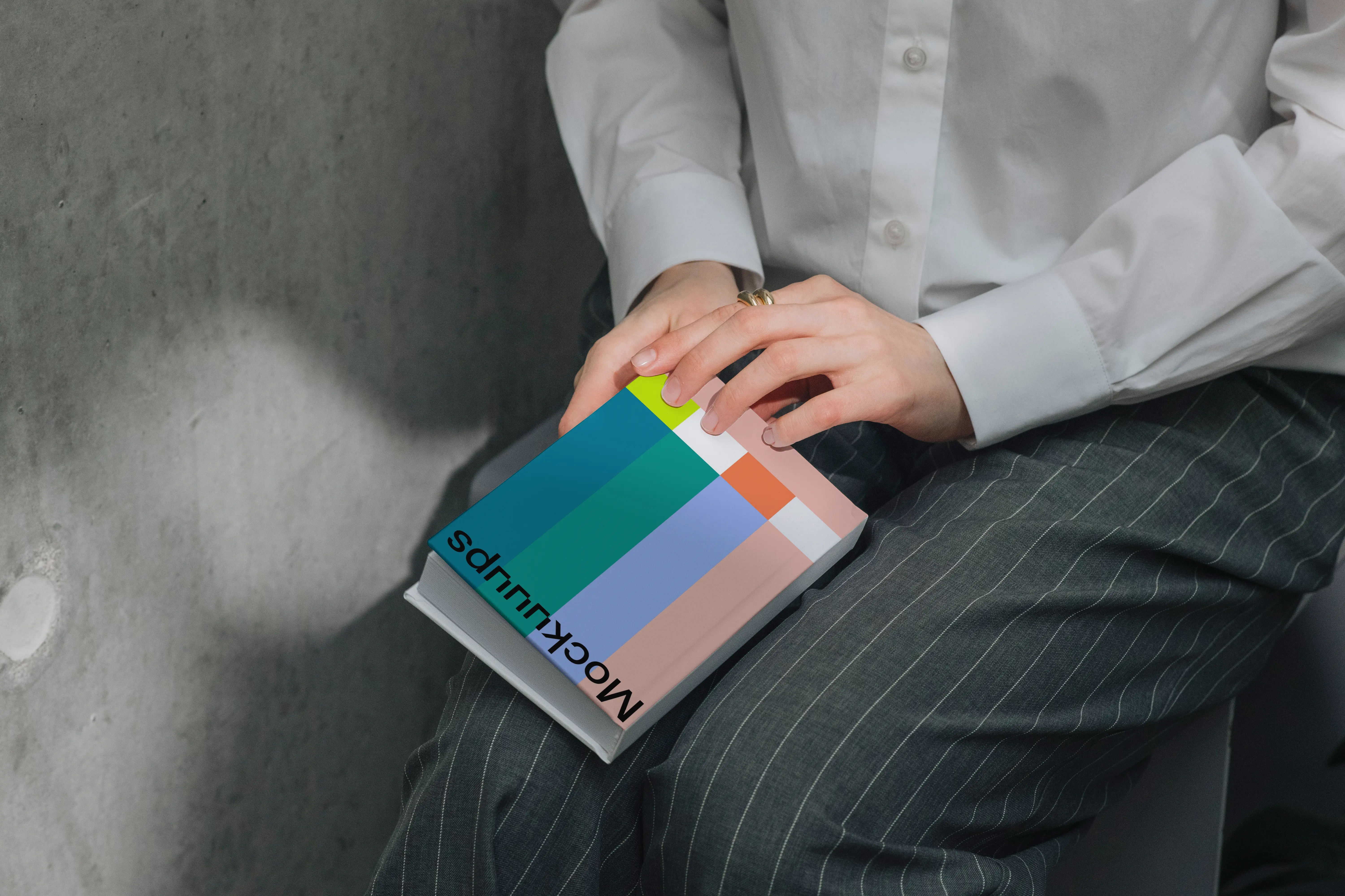 Book mockup resting on a person's lap in natural lighting mockup
