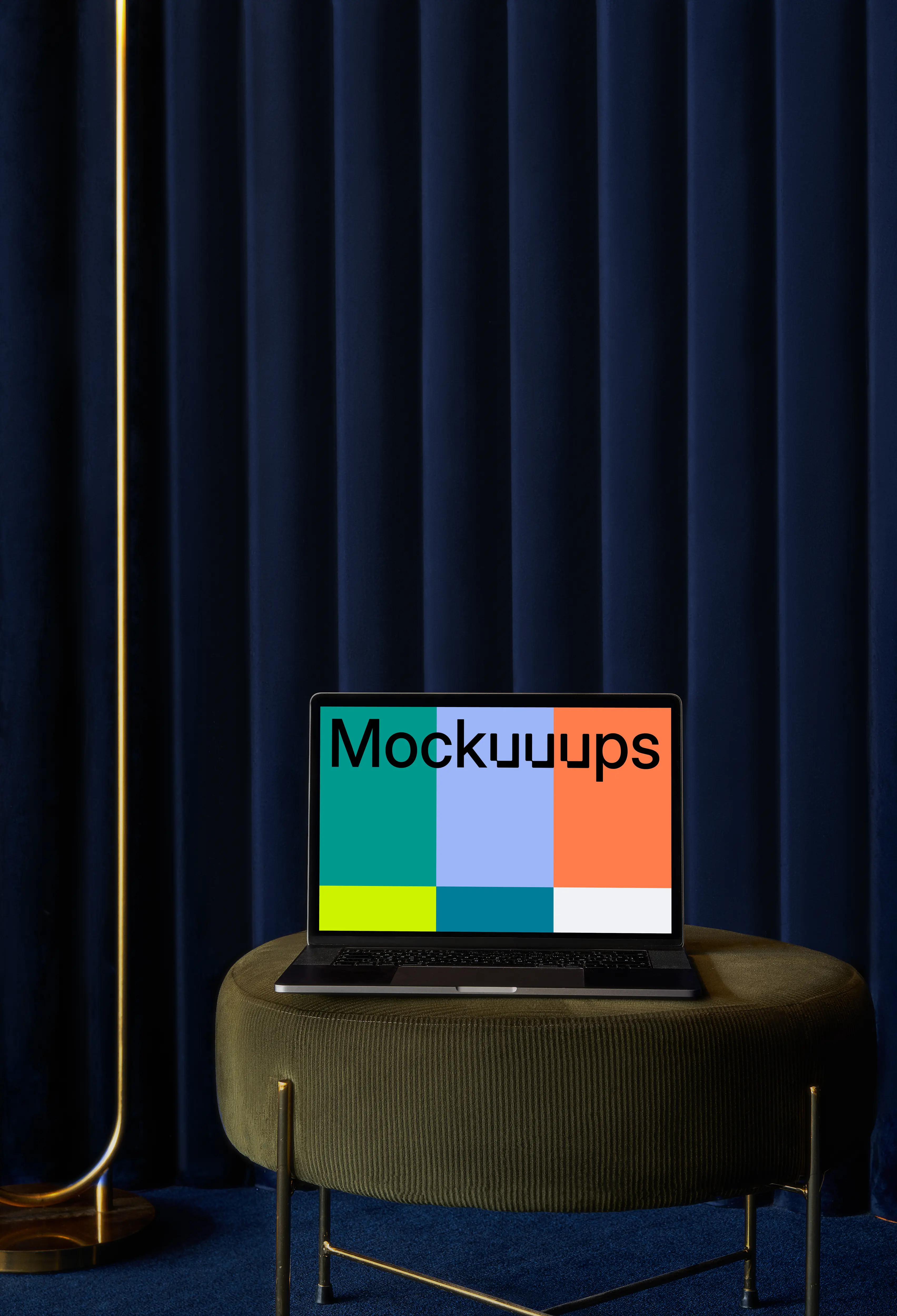 MacBook mockup on a sofa stool with blue curtain in the background mockup