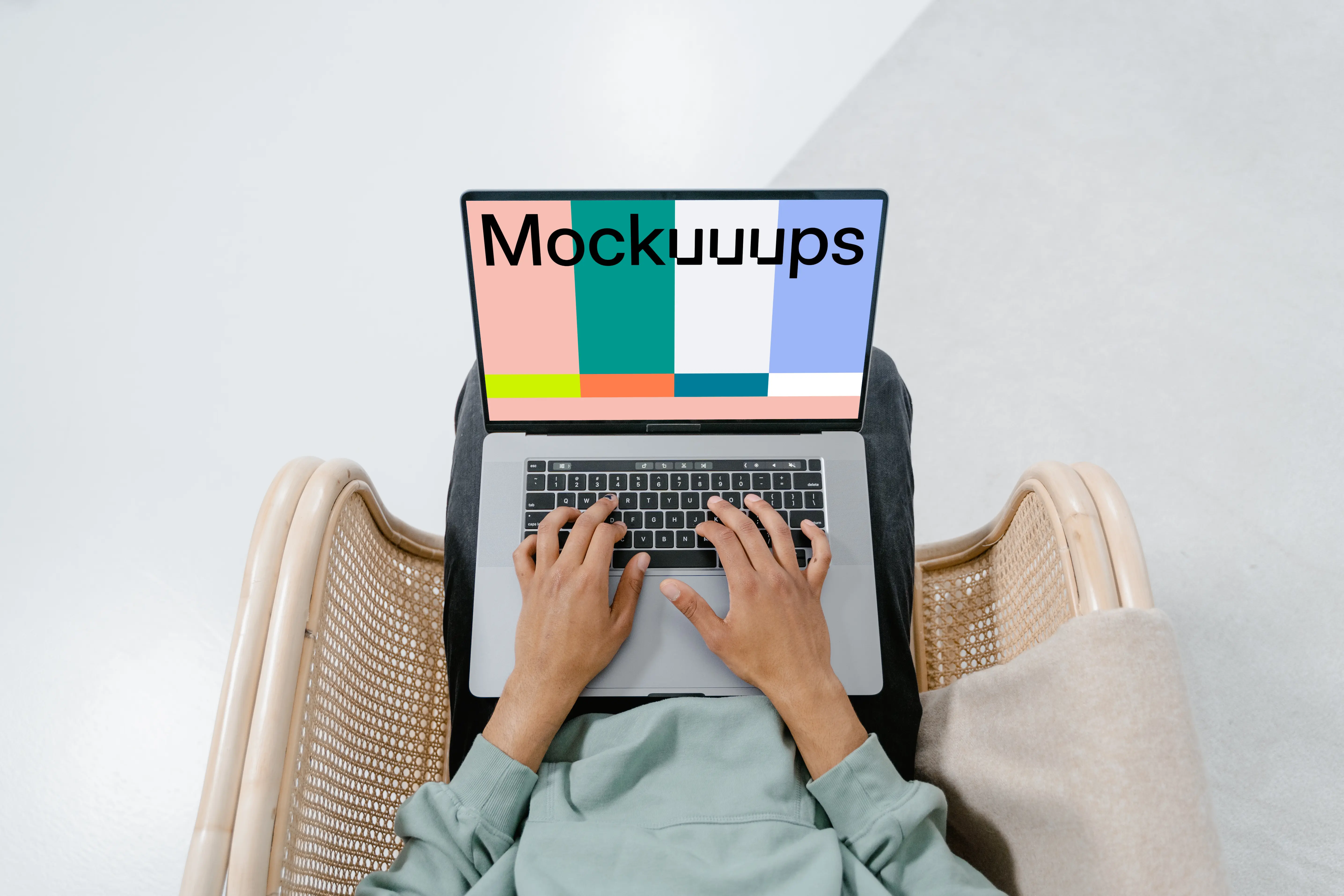 MacBook mockup on a user's laps