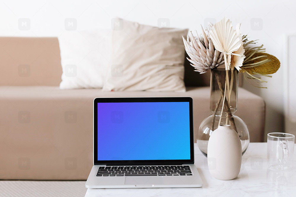 MacBook Mockup on a coffee table in a minimal living room