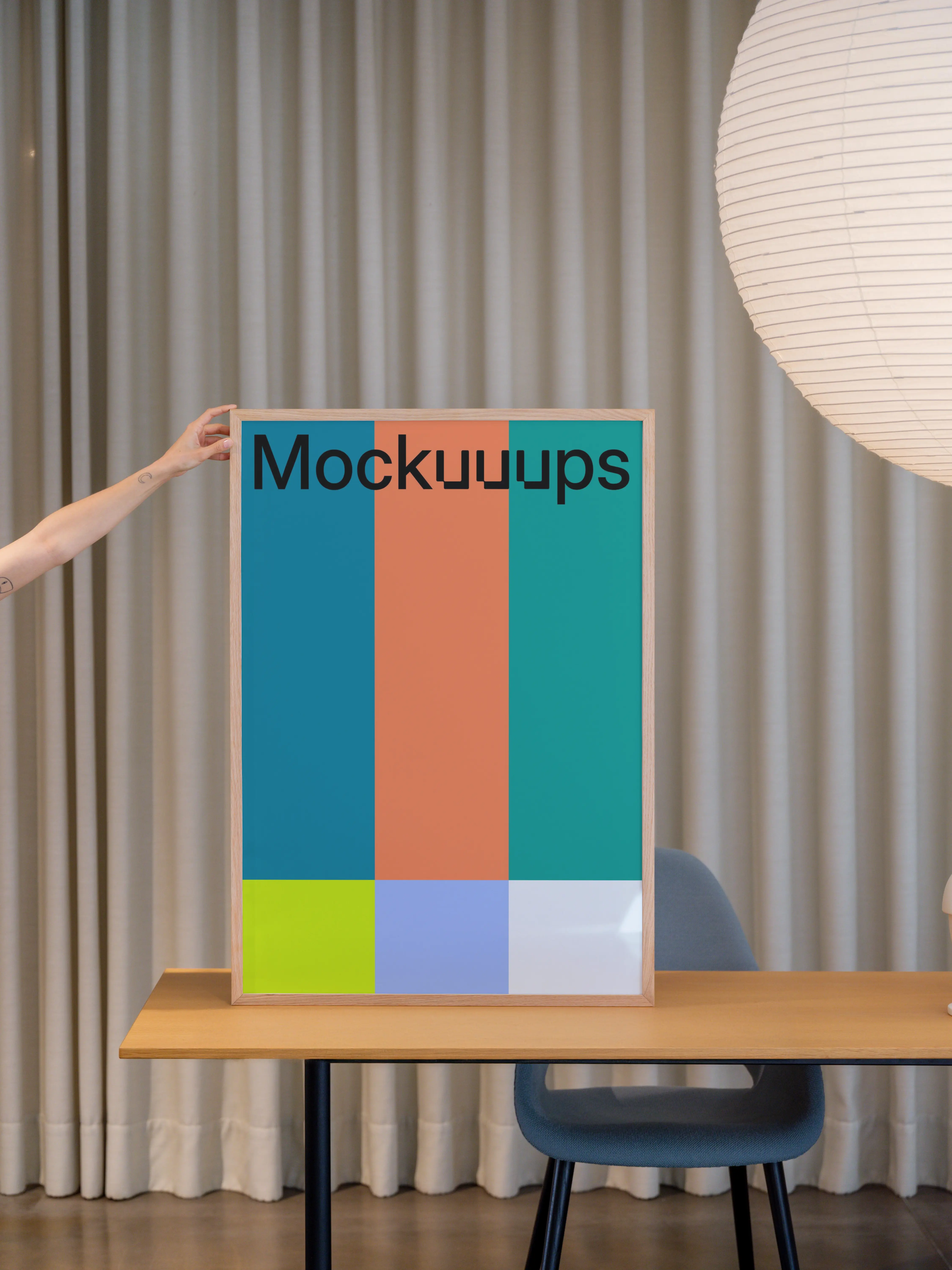 Poster mockup on a wooden desk with neutral background mockup