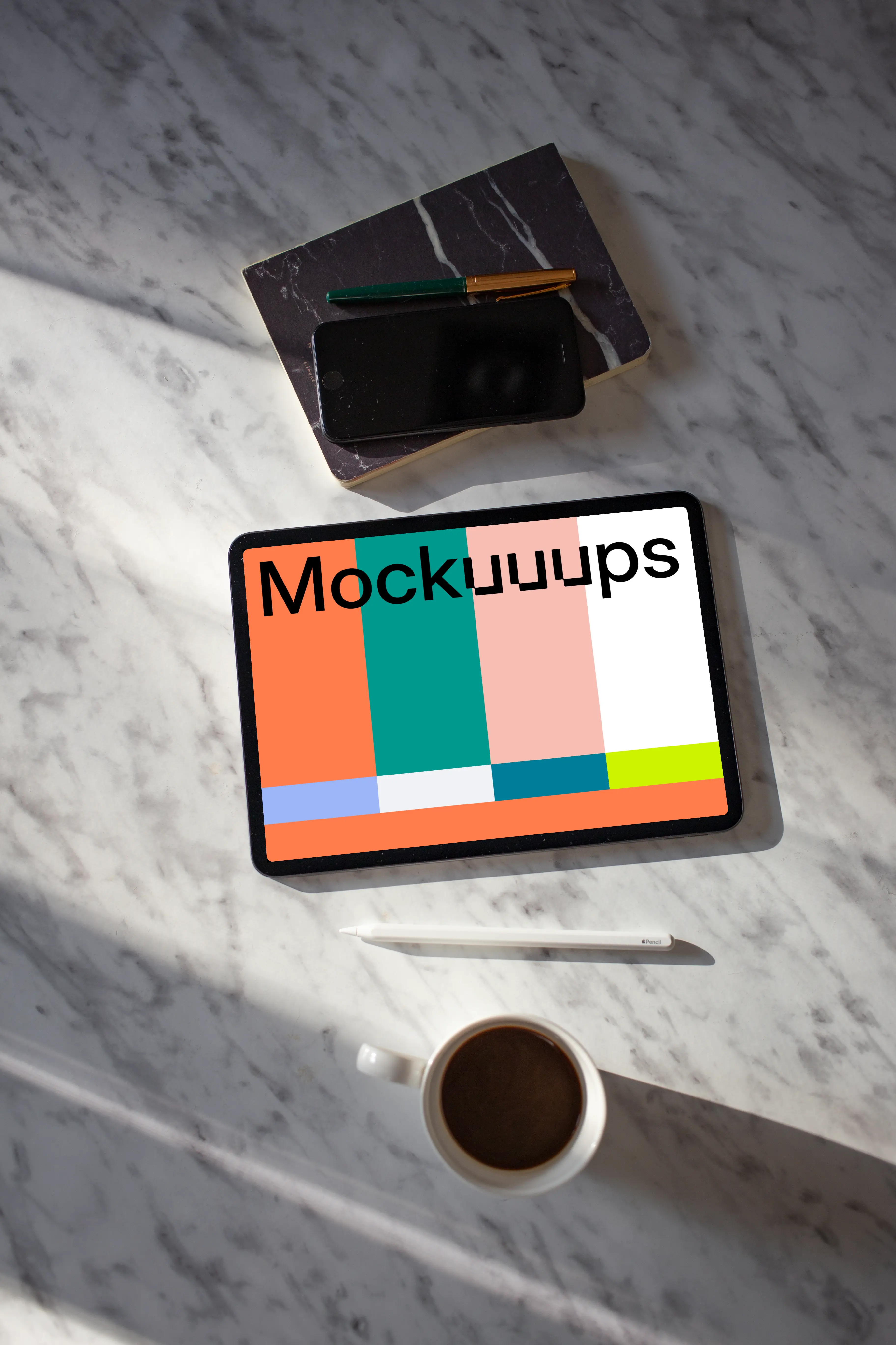 Tablet mockup on a table with an iPhone at the side