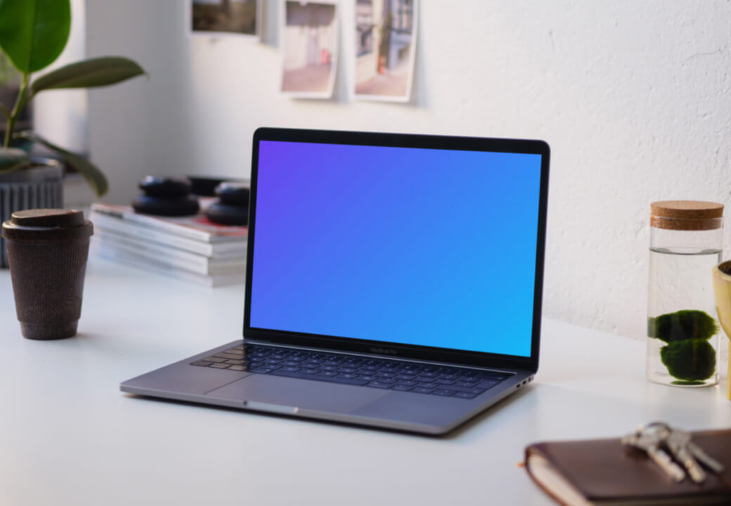 Side view of the Macbook Pro mockup on white table