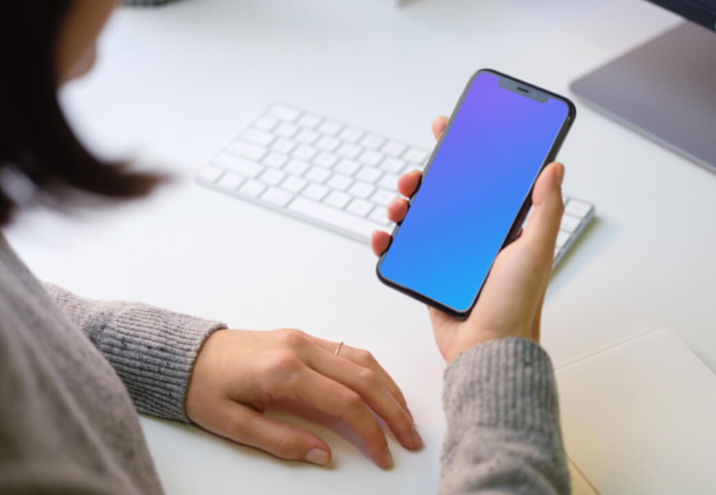 Woman holding iPhone Mockup