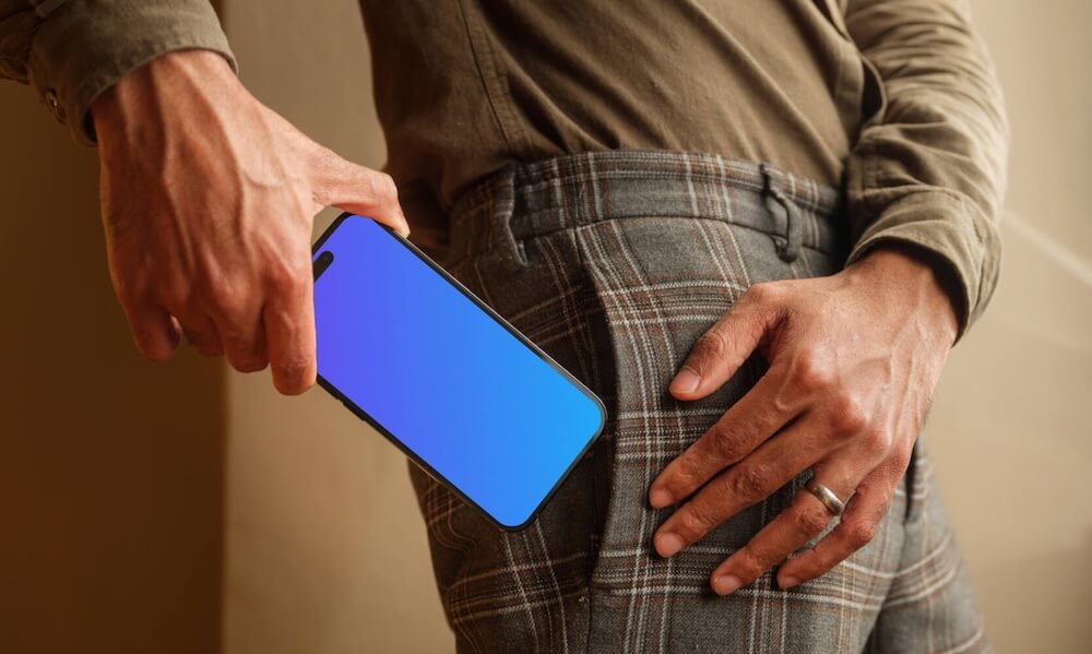 iPhone mockup sliding into the pocket